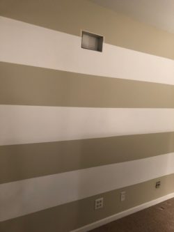 DIY tutorial of how to paint perfect stripes on a wall